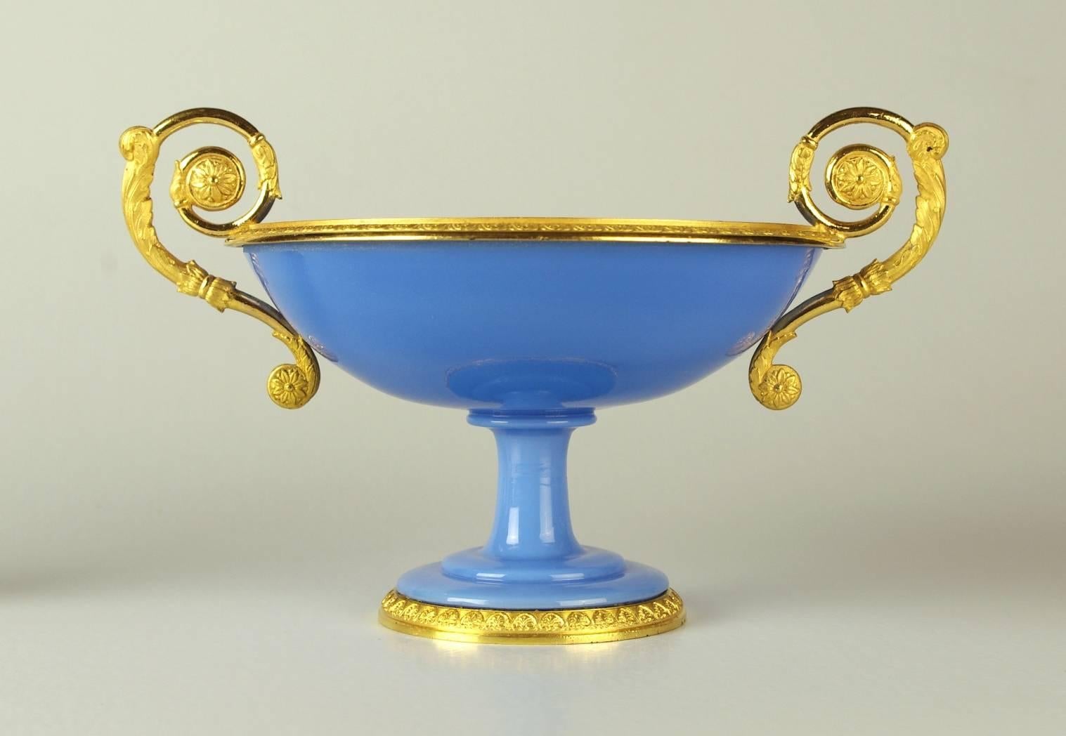 Fine and rare Charles X blue opaline compote, the bowl mounted with matte and burnished scroll handles; the rim and foot with palmettes.

This gorgeous objet d'art dates to circa 1825-1830, the early days of opaline production. The quality of the