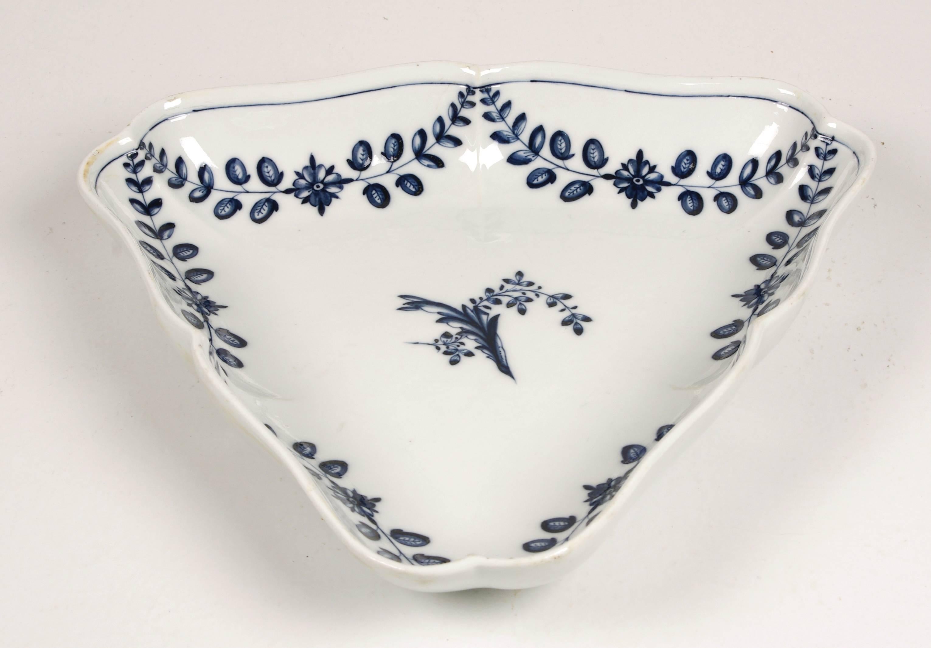 Marcolini Meissen Porcelain triangular serving tray decorated in underglaze blue with the Festoon and branch pattern. Crossed swords mark with star.

The Marcolini period in Meissen Porcelain is indicated by the star beneath the crossed swords.
