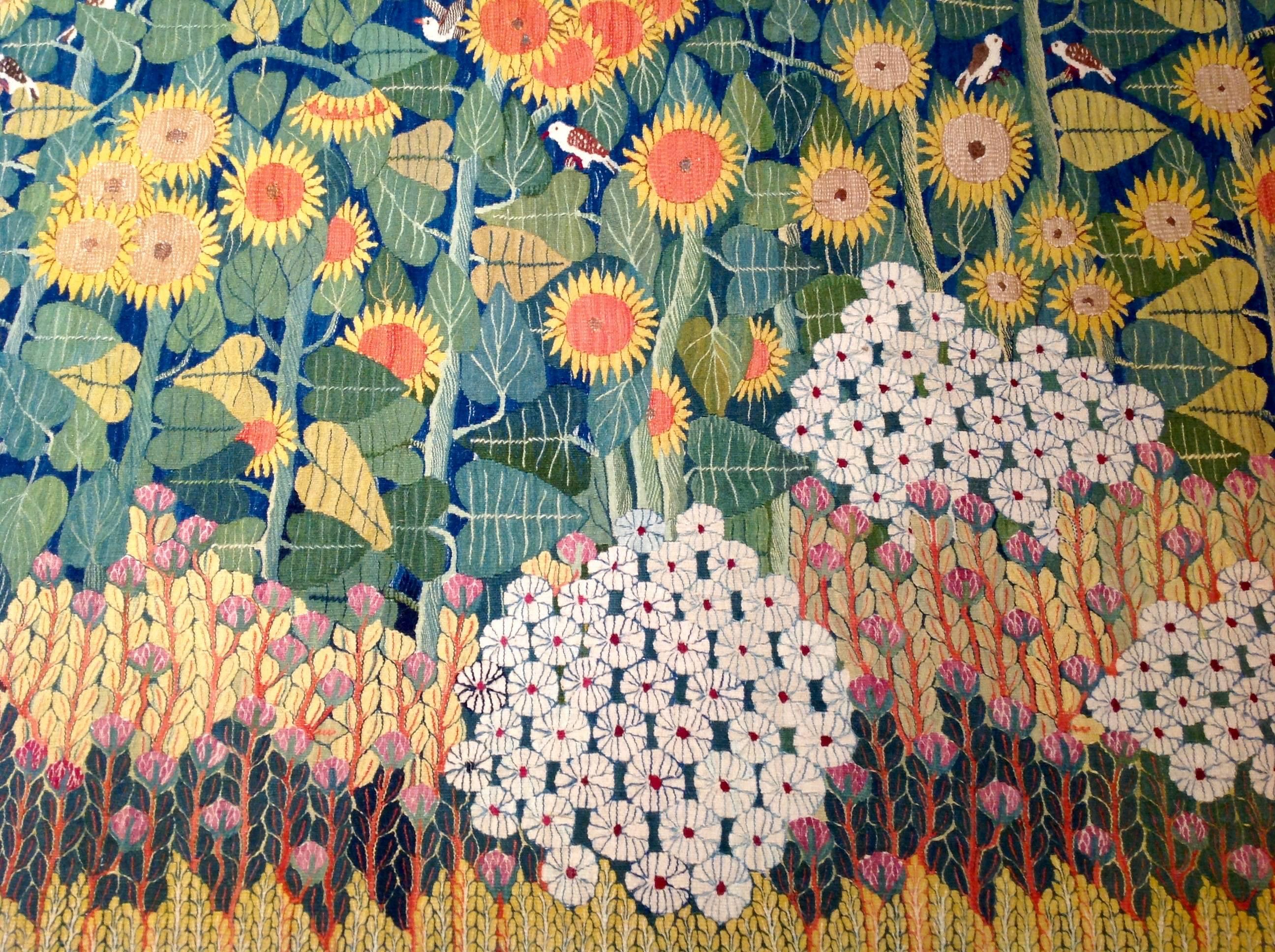 Charming tapestry depicting a sunflower scene. It was handwoven by a young woman artist in the Ramses Wissa Wassef Art Center in Giza Egypt. The tapestry center, founded in 1952 by Ramses Wissa Wassef, was dedicated to releasing the innate