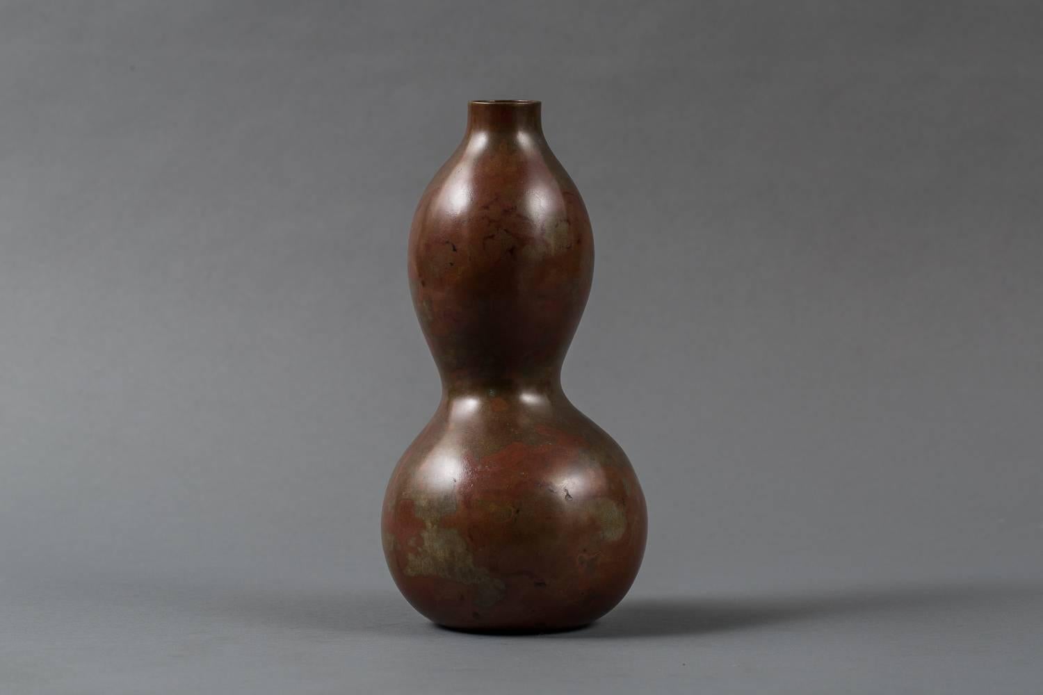 Japanese Bronze Gourd Shaped Vase with mottled, rust colored patina.  Signed: Yasuyoshi.