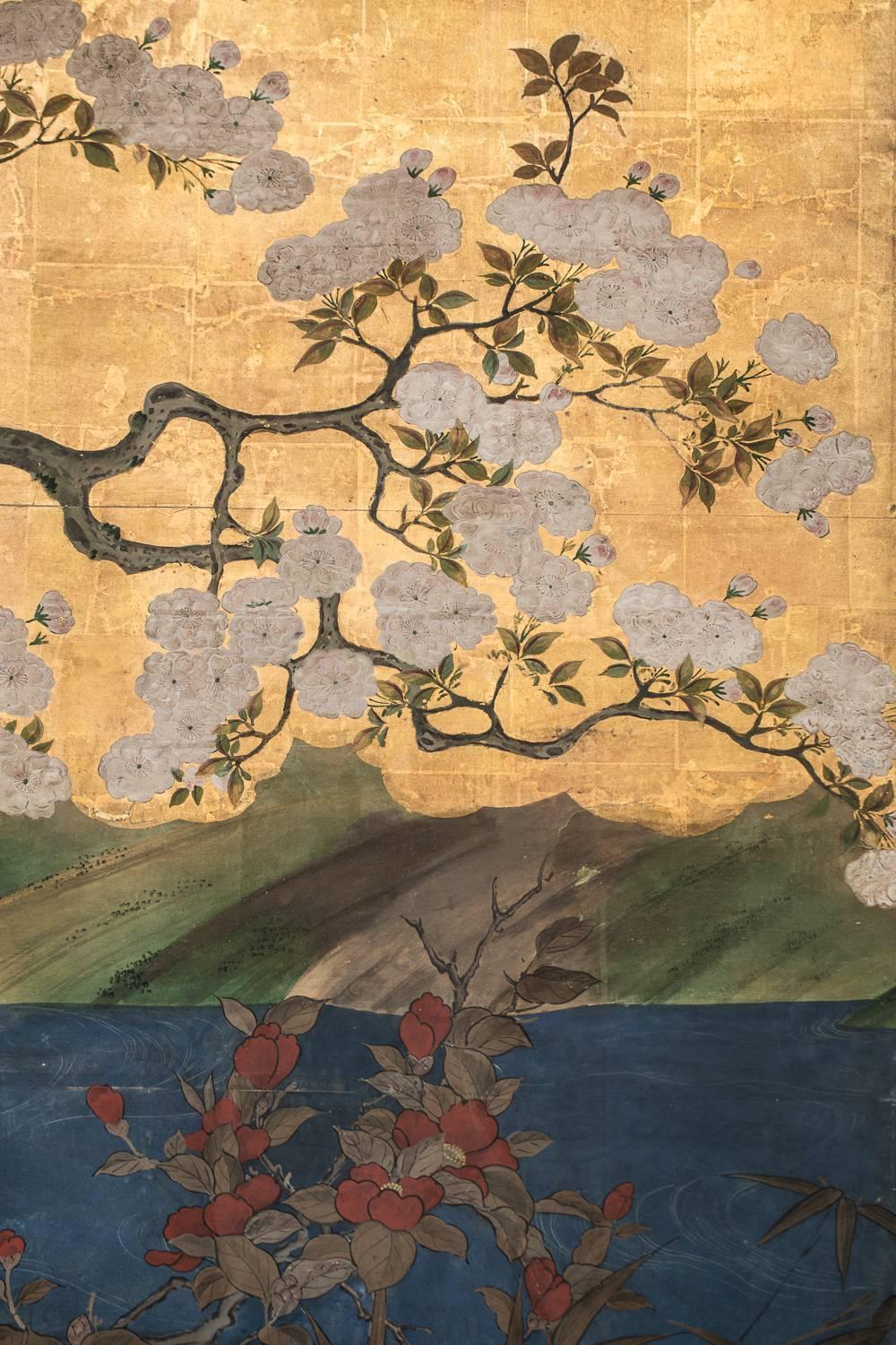 Japanese Six Panel Screen:  Flowering Cherry Tree with Raised Blossoms
Waterfront landscape with garden stones on edge, water fowl, Rimpa style flowers: roses, cherry, dandelion, lilies and red camellias
Mineral pigments on beautifully patinated