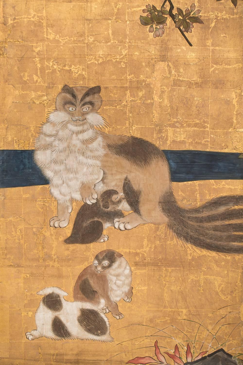 Japanese six-panel screen: Mother and her kittens under flowering cherry tree.
Kano School painting, mineral pigments on gold, with beautiful early bronze mounts.