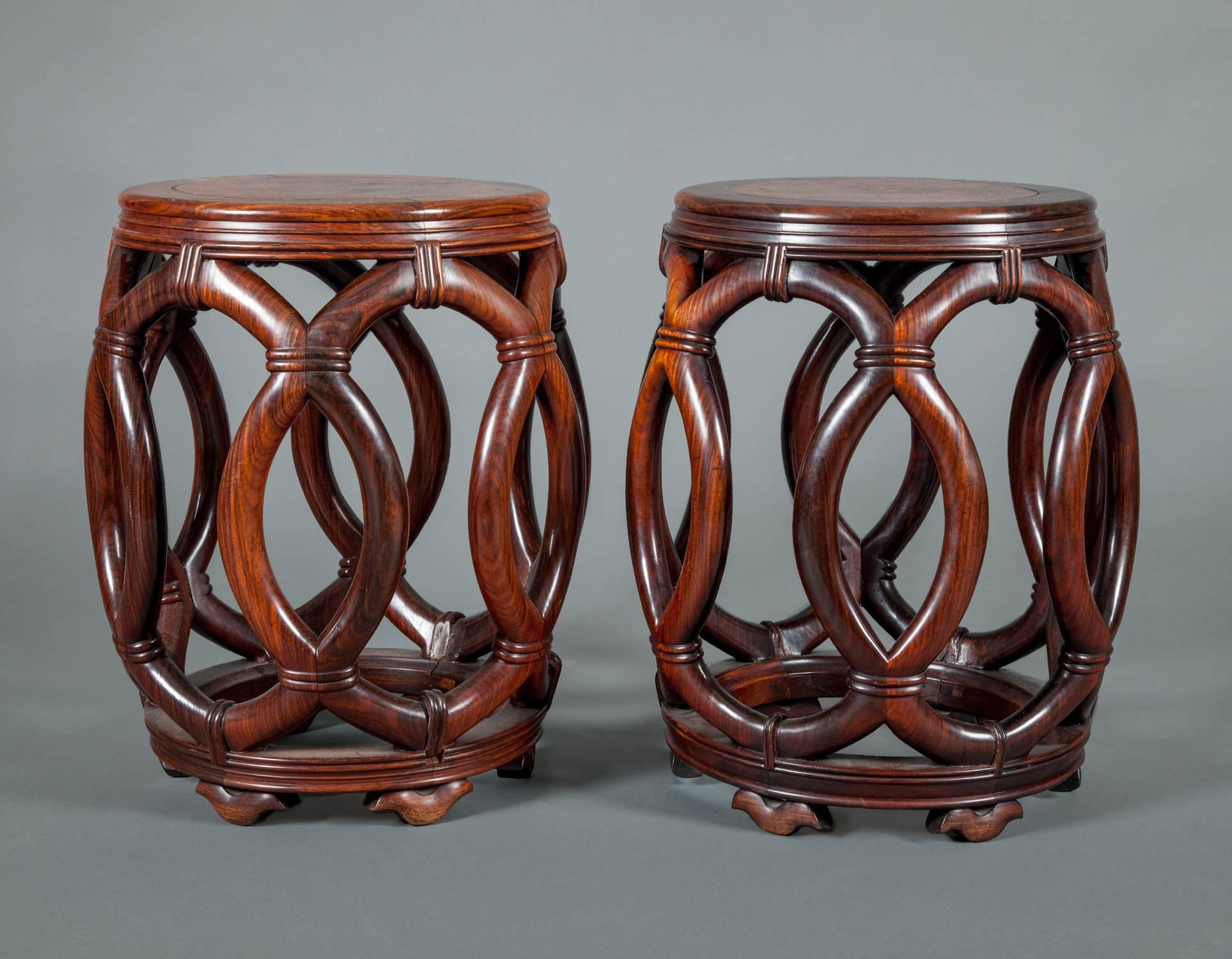 Pair of Chinese hardwood garden seats
Each inset with beautiful burl wood top above pierced body, ending in circular bottom.