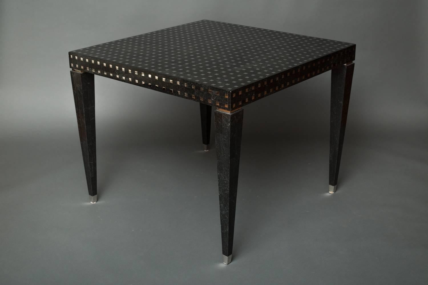 Black marble and chrome veneered square table.