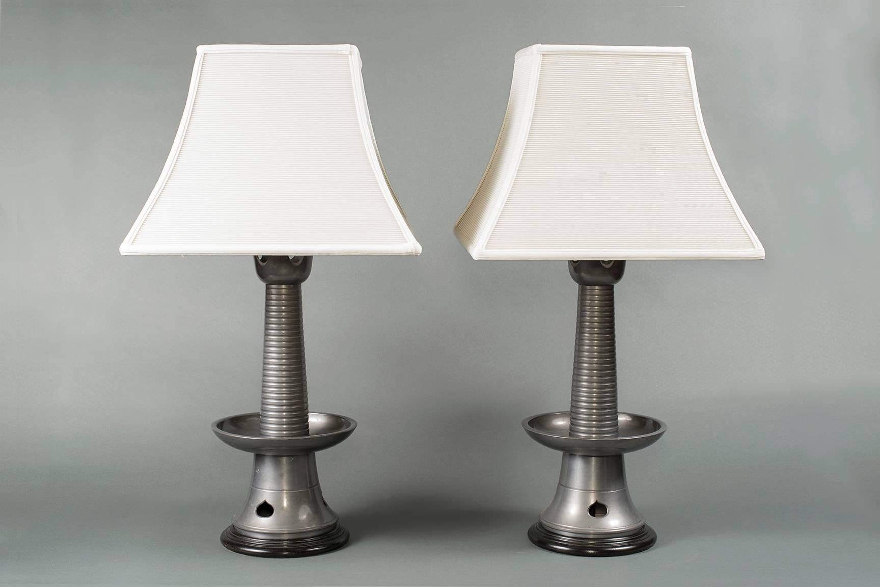 Pair of Japanese pewter lamps.

Pair of Japanese pewter lamps,
Japan,
circa 1950.
Measures: 20