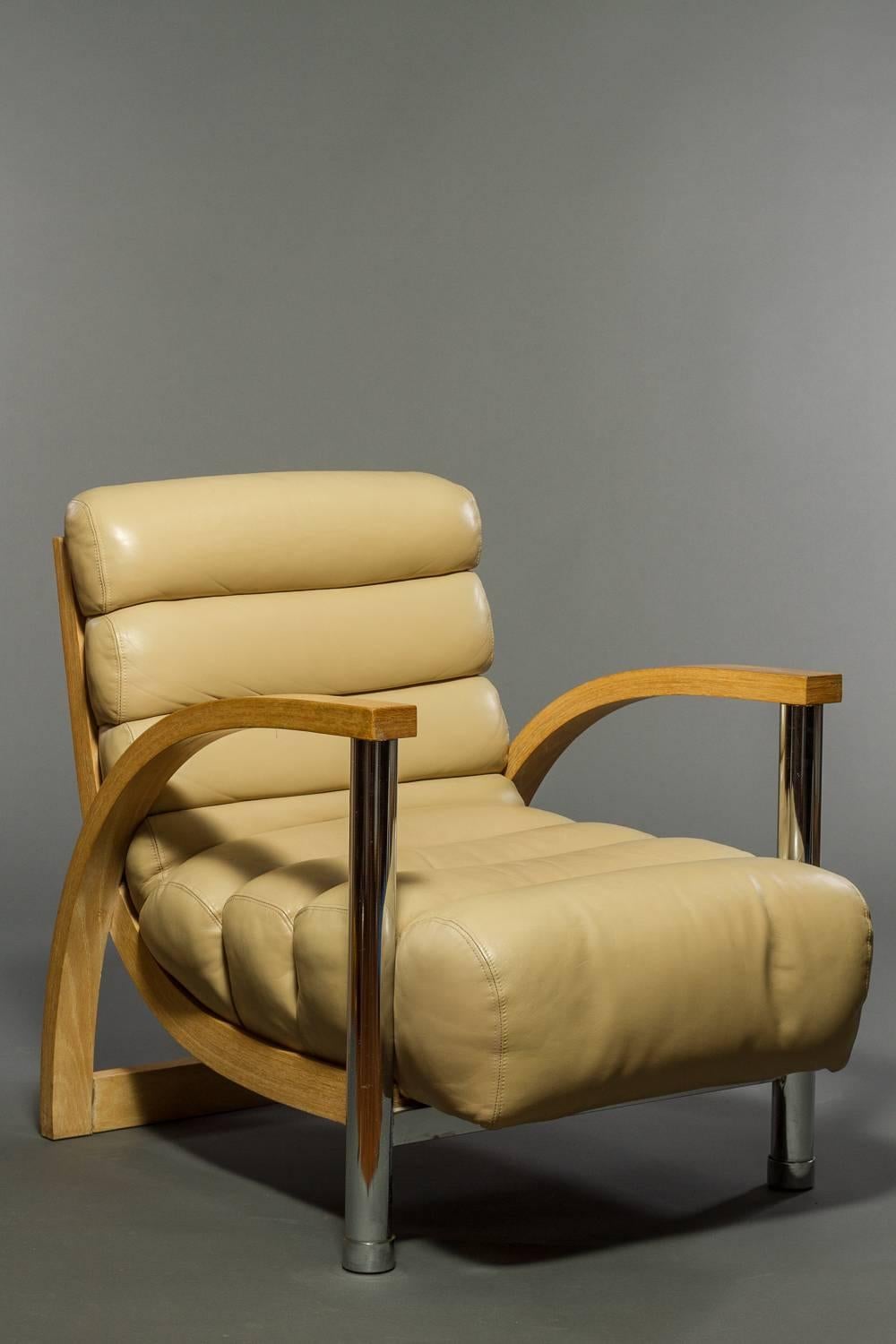 Very comfortable club chair by designer Jay Spectre.  Featuring original channeled leather cushion back and seat with crushed oak and tubular chrome frame. 
