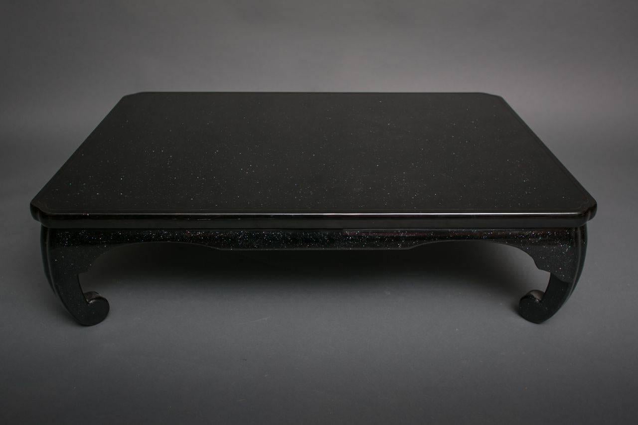 Japanese black lacquer coffee table with mother-of-pearl design.
