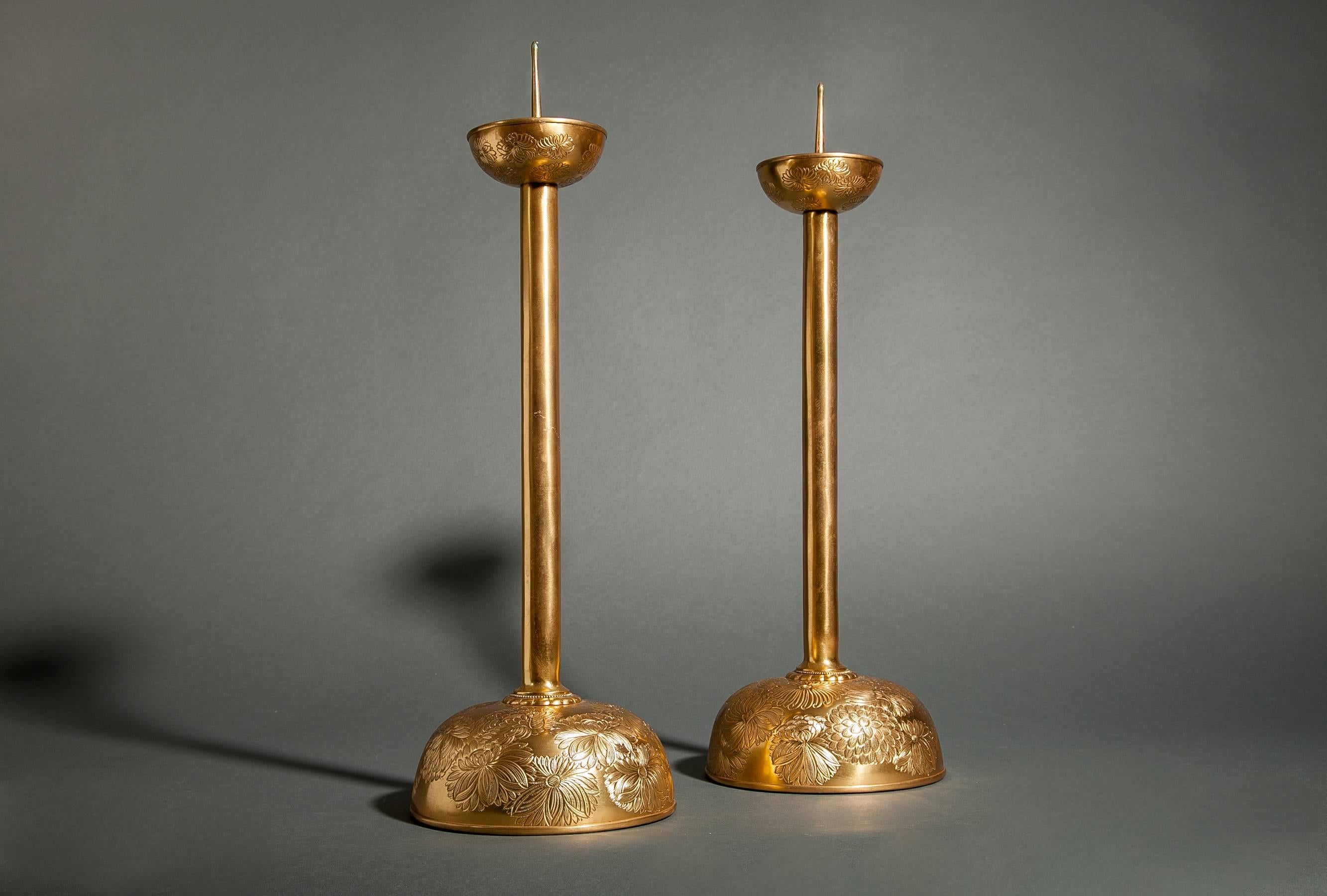 Pair of gilded bronze candlesticks with chrysanthemum design on base. Original wood storage box.