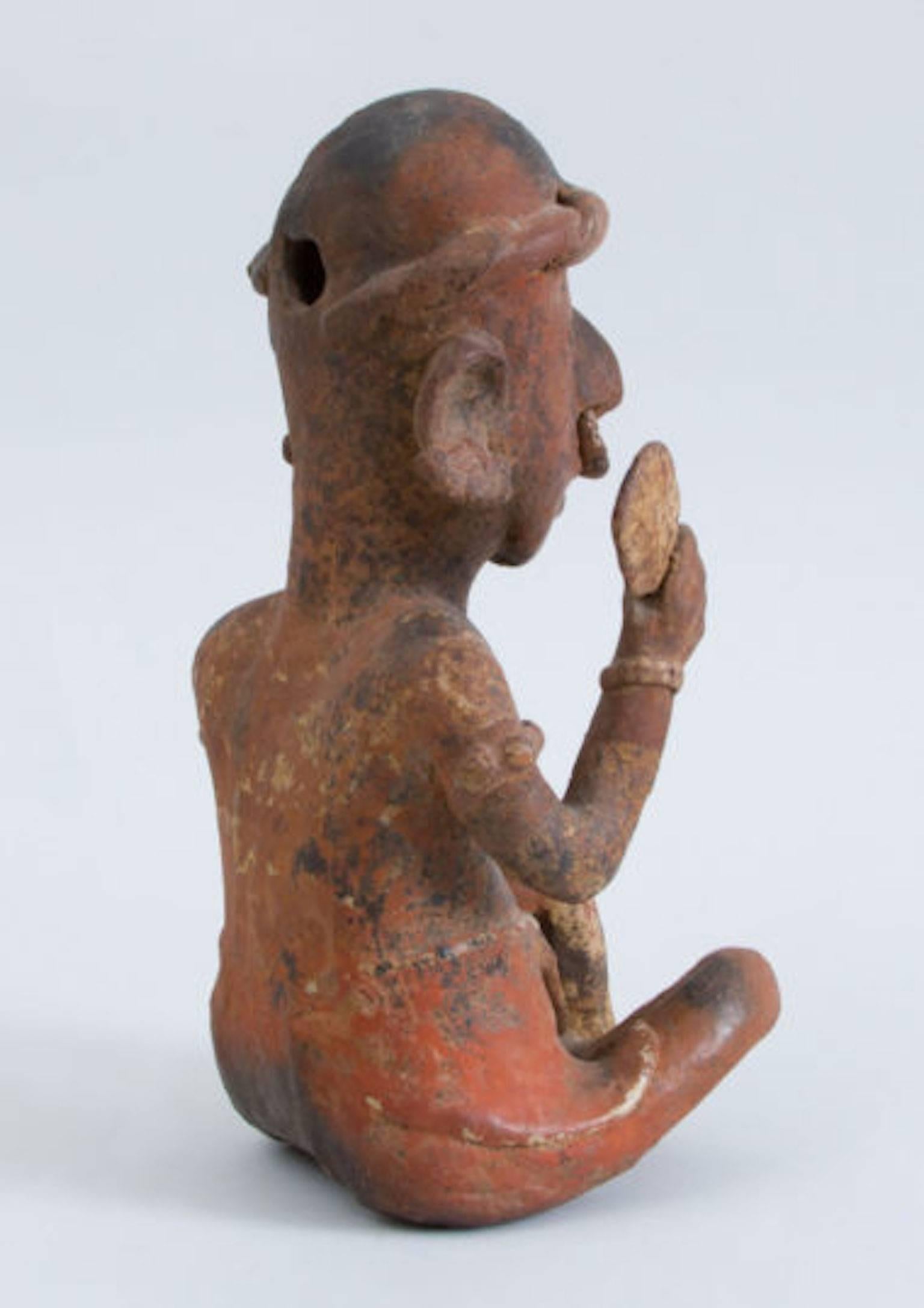 Pre-Columbian Painted Pottery Figure of a Seated Male