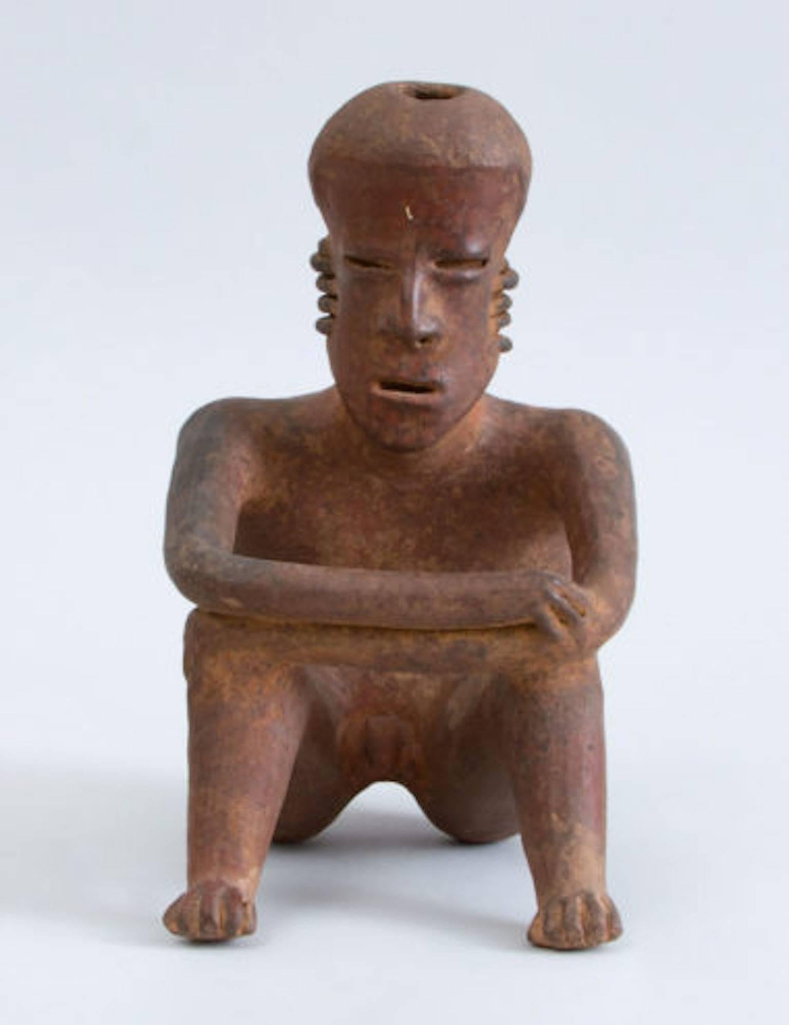 Mexican Pre-Columbian Red-Ground Pottery Seated Figure of a Man