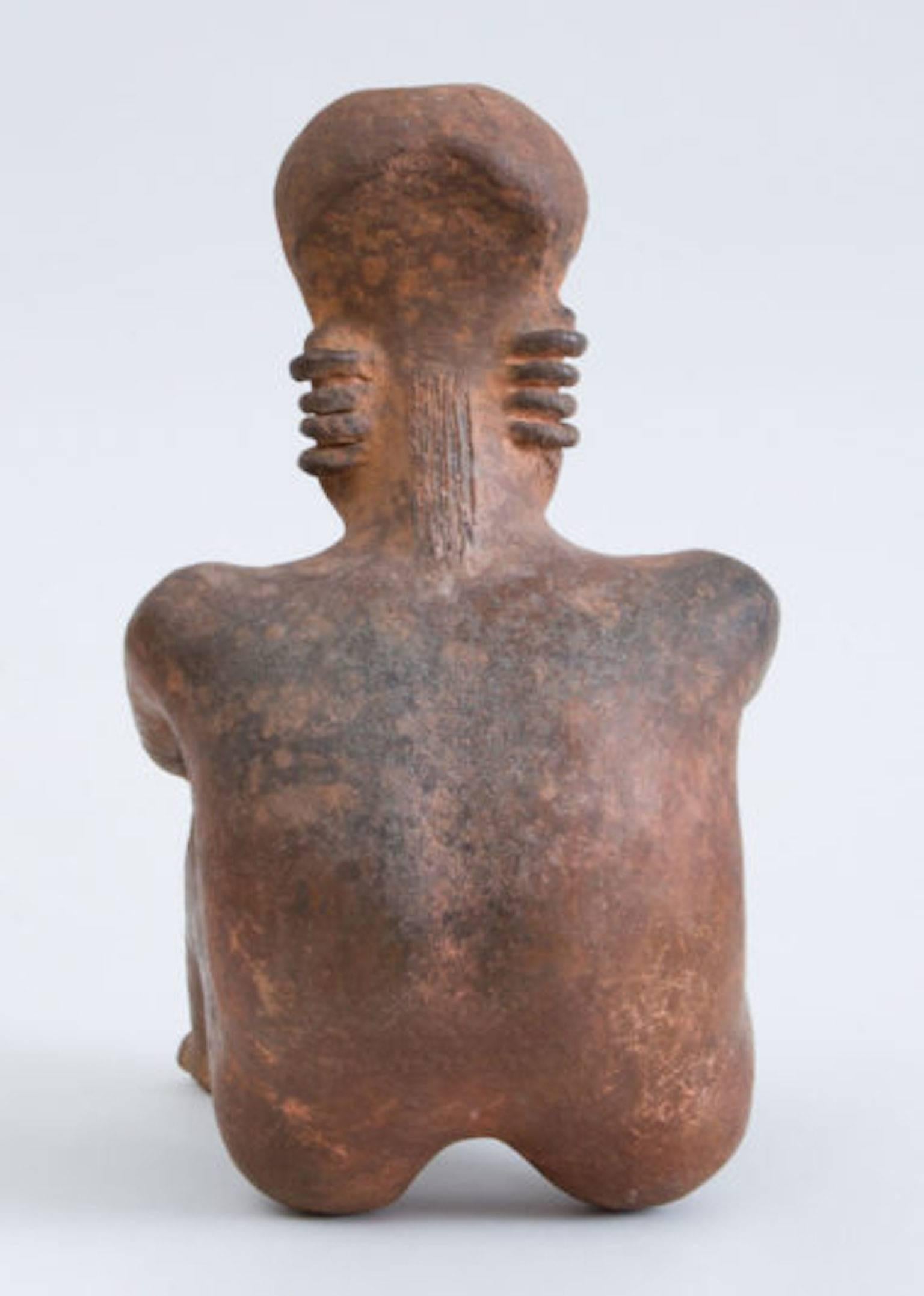 18th Century and Earlier Pre-Columbian Red-Ground Pottery Seated Figure of a Man