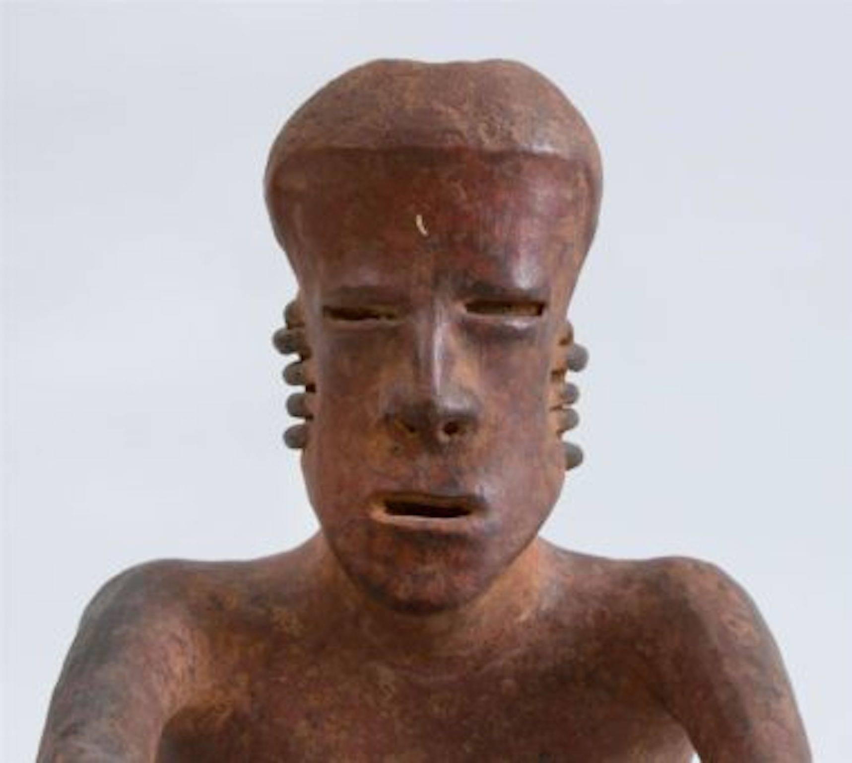 Pre-Columbian Red-Ground Pottery Seated Figure of a Man 1