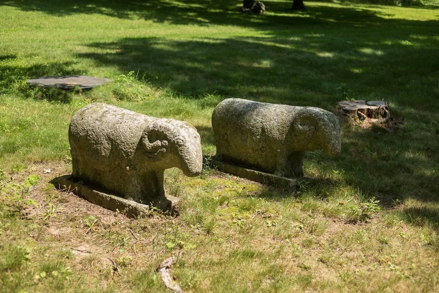 Pair of early 16th century granite ram garden sculptures.