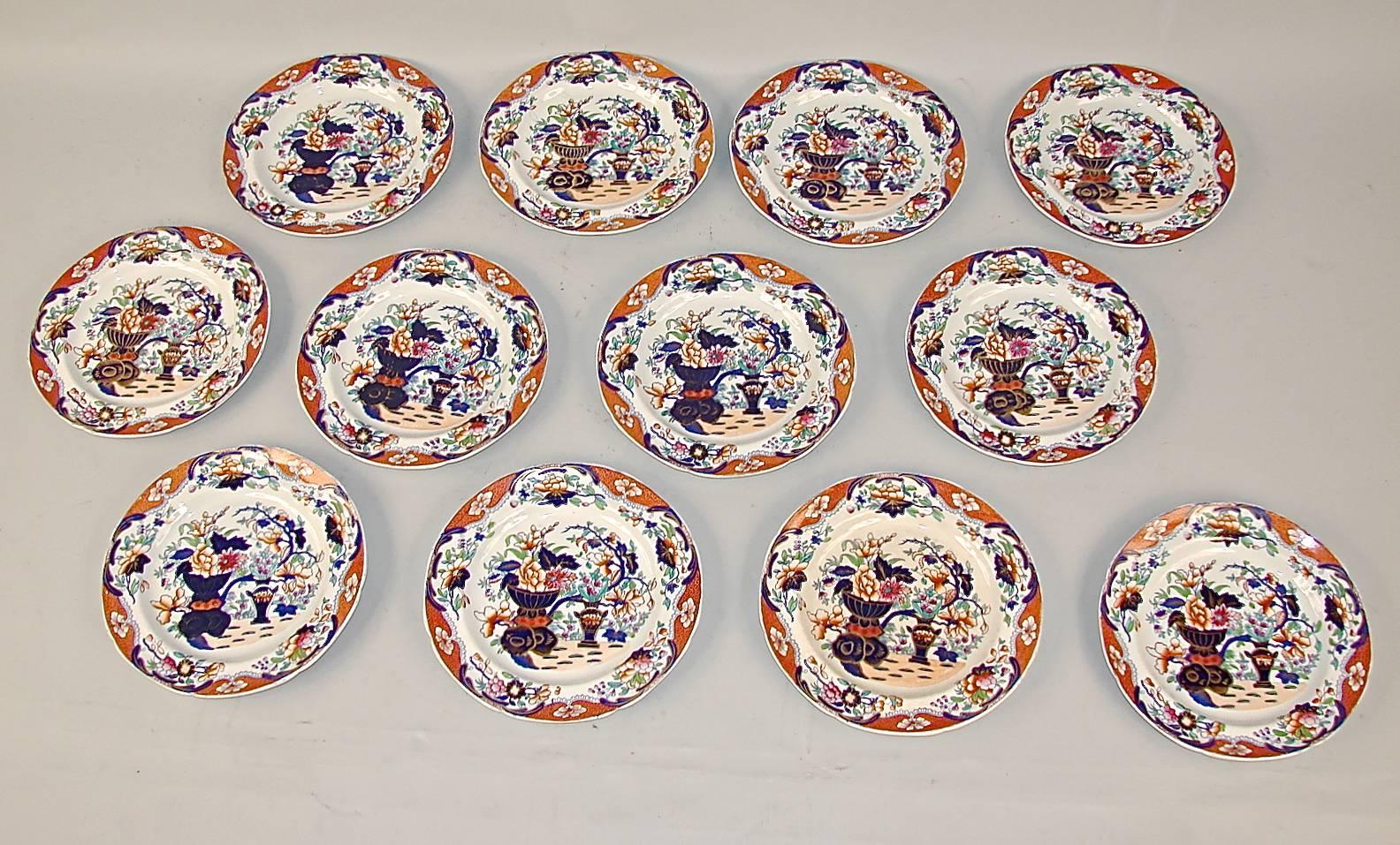 A set of 12 Imari pattern Spode dinner plates with impressed mark on underside and numbered #3875, circa 1840.