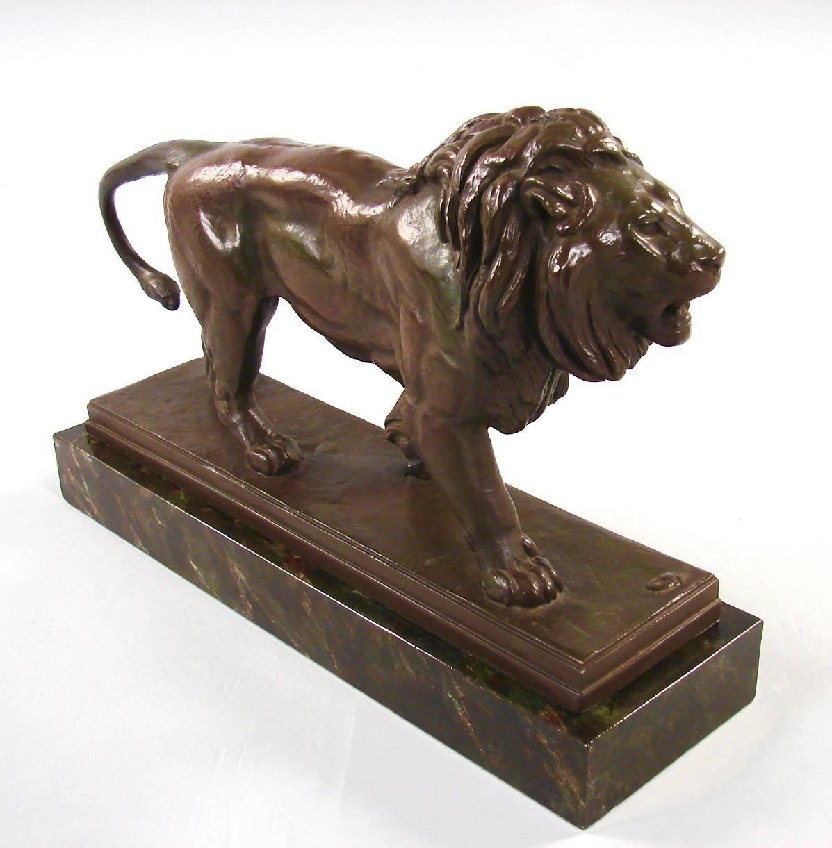 A plaster cast model of a majestic lion after the original by Antoine Louis Barye, entitled 
