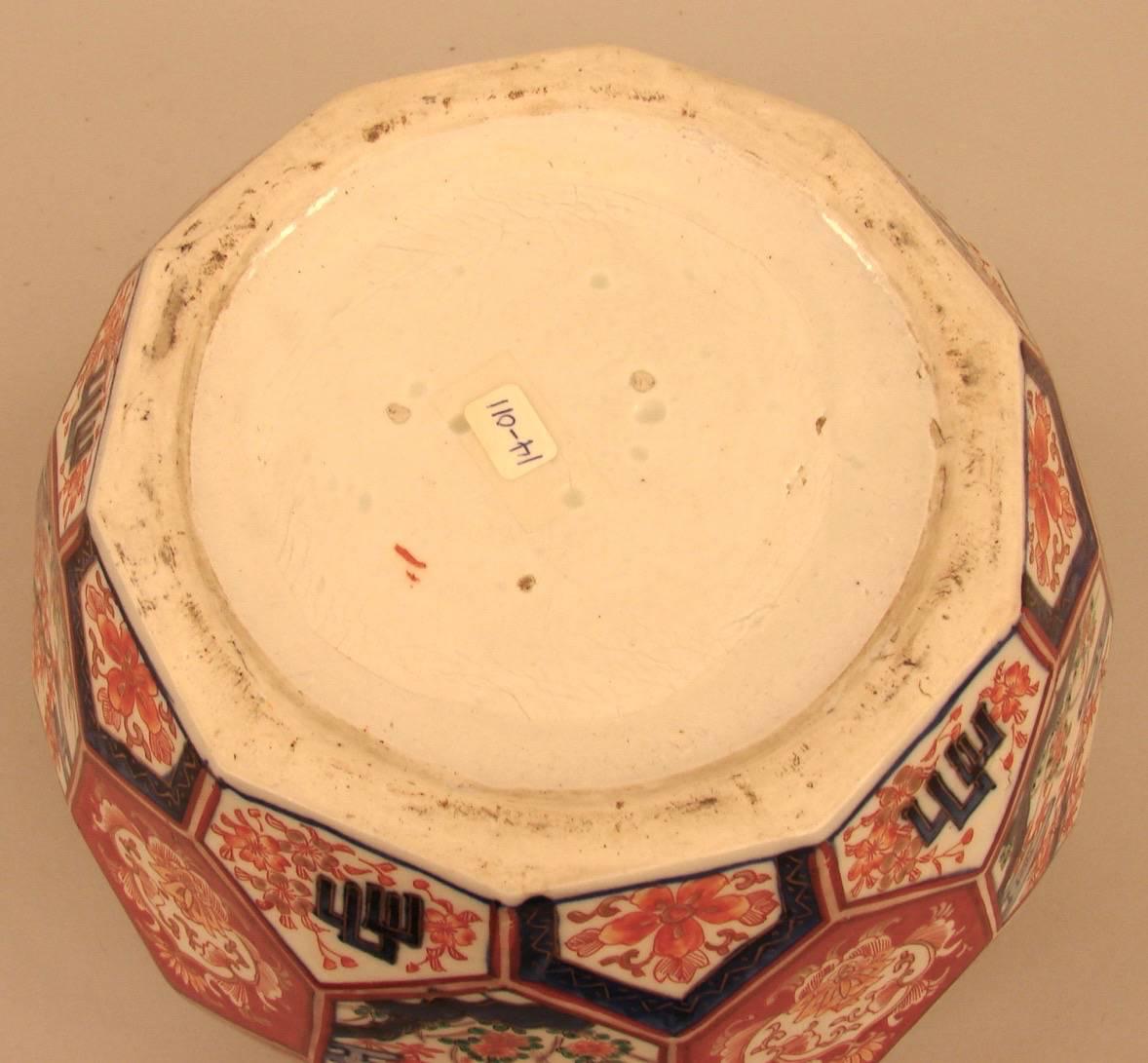 An unusual Japanese Meiji period planter of faceted form, decorated overall in typical Imari colors with foliate designs.