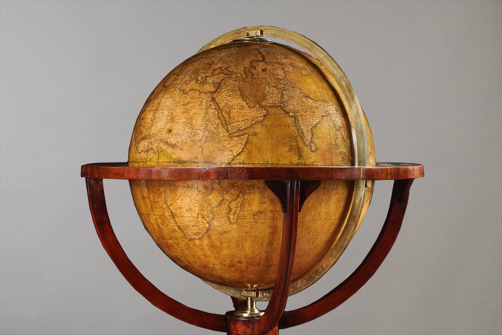 An attractive 16 inch diameter terrestrial floor standing globe, made and signed by Manning & Wells, London, dated 1854. This globe retains its original signed compass incorporated into the stretcher. Restored.