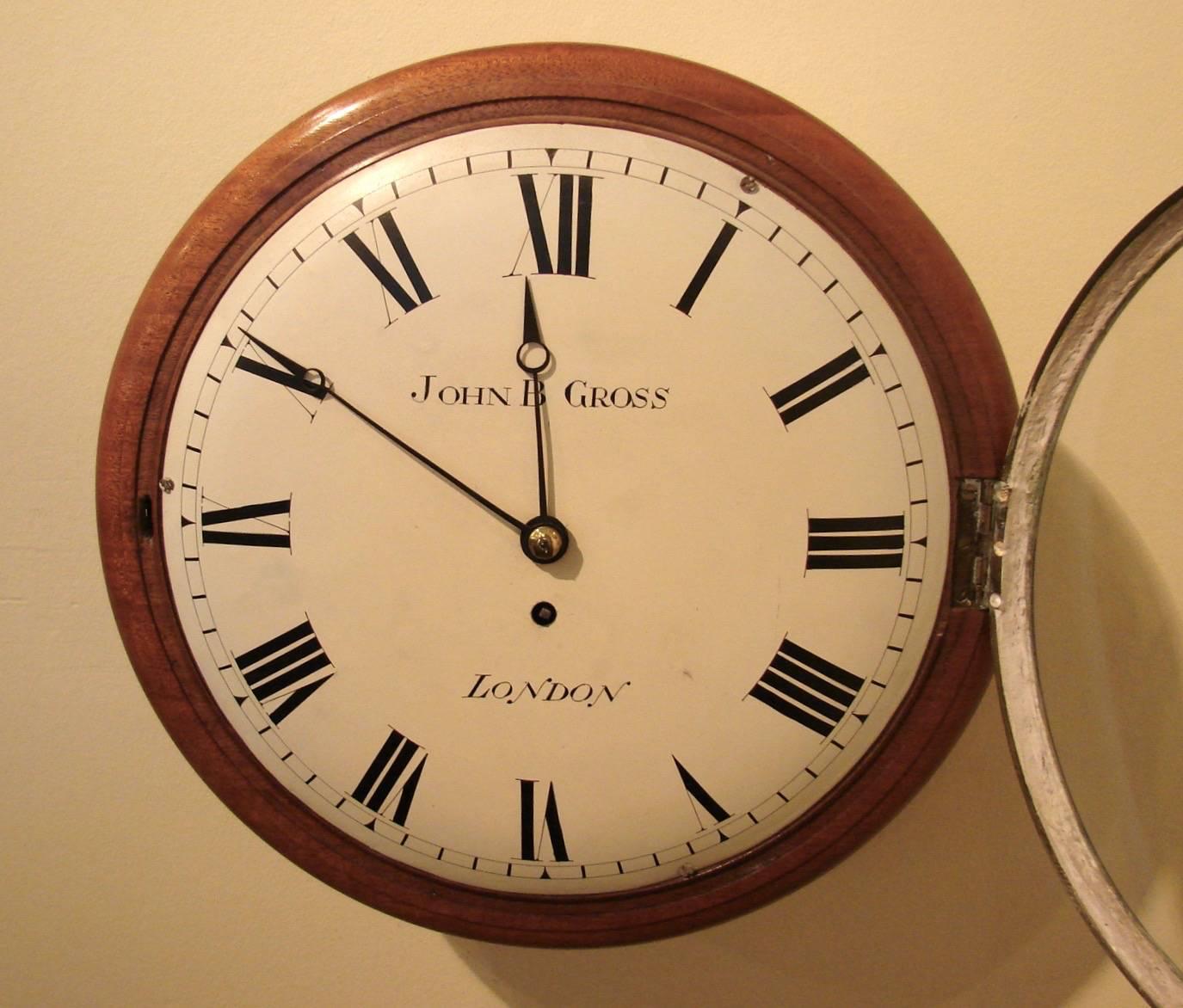 An English mahogany and oak wall clock made and signed by John B. Gross, the fusee movement in working order, the 12 inch diameter dial with painted roman numerals, circa 1850.