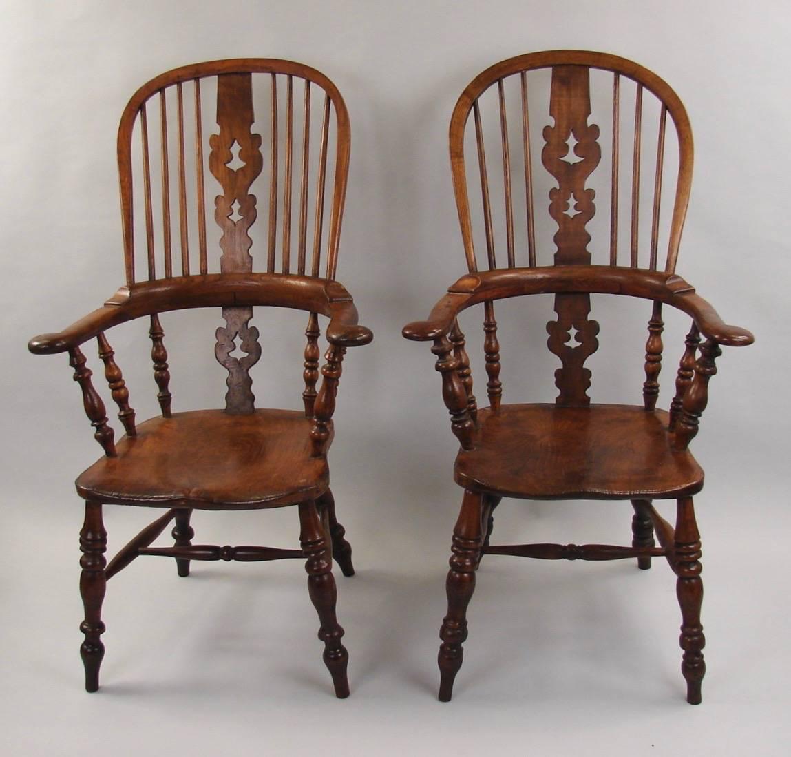English Harlequin Set of Eight Elm and Ash Broad Arm High Back Windsor Chairs