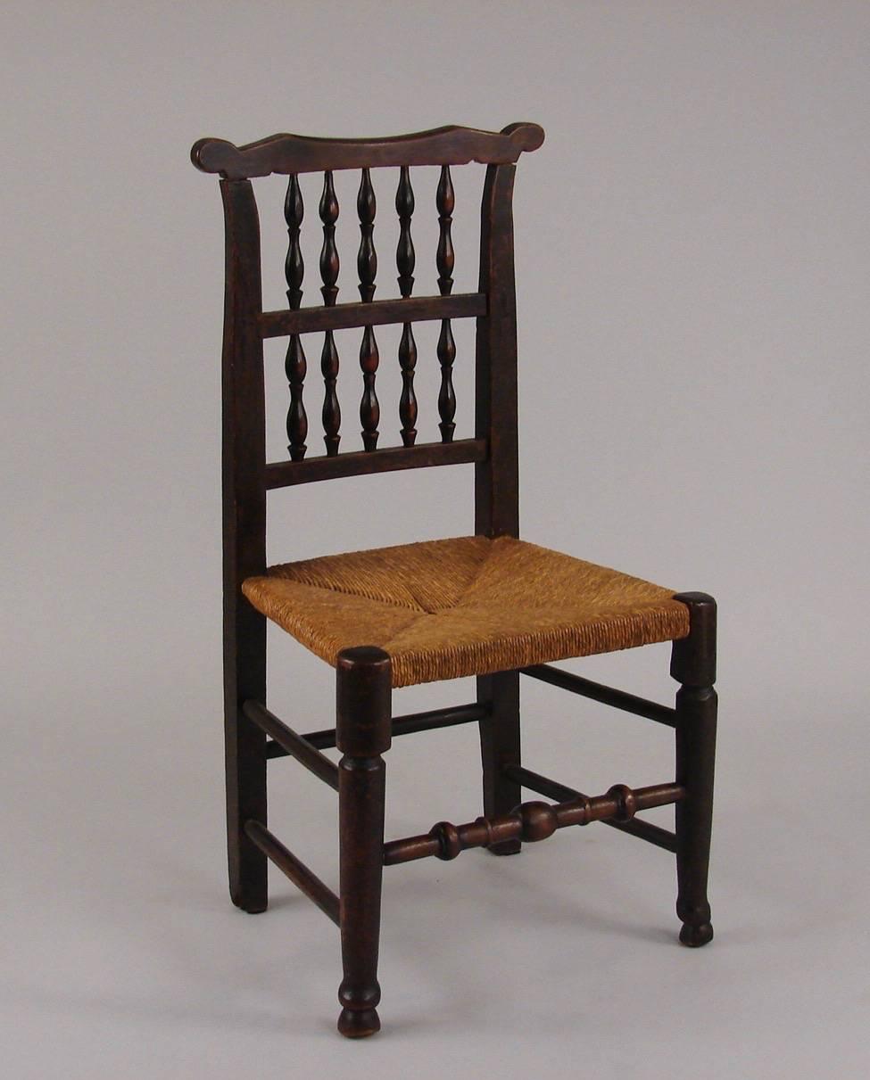 Late 19th Century English Elm Provincial Spindle Back Chairs with Rush Seats, Set of 8