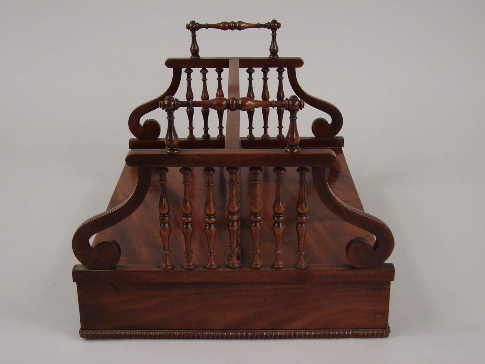 An English late Regency period goncalo alves book carrier, the top with a gallery and carry handles above a single drawer, circa 1835.