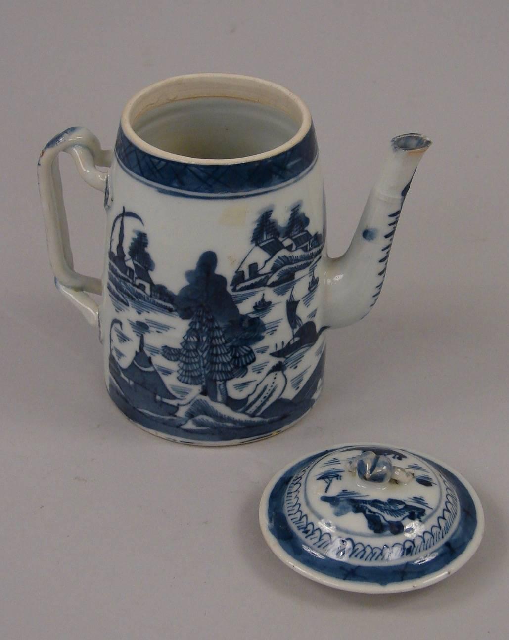 A scarce Chinese export canton blue and white coffee pot of small size depicting traditional scenes of river life complete with original twig handle and lid, circa 1850.