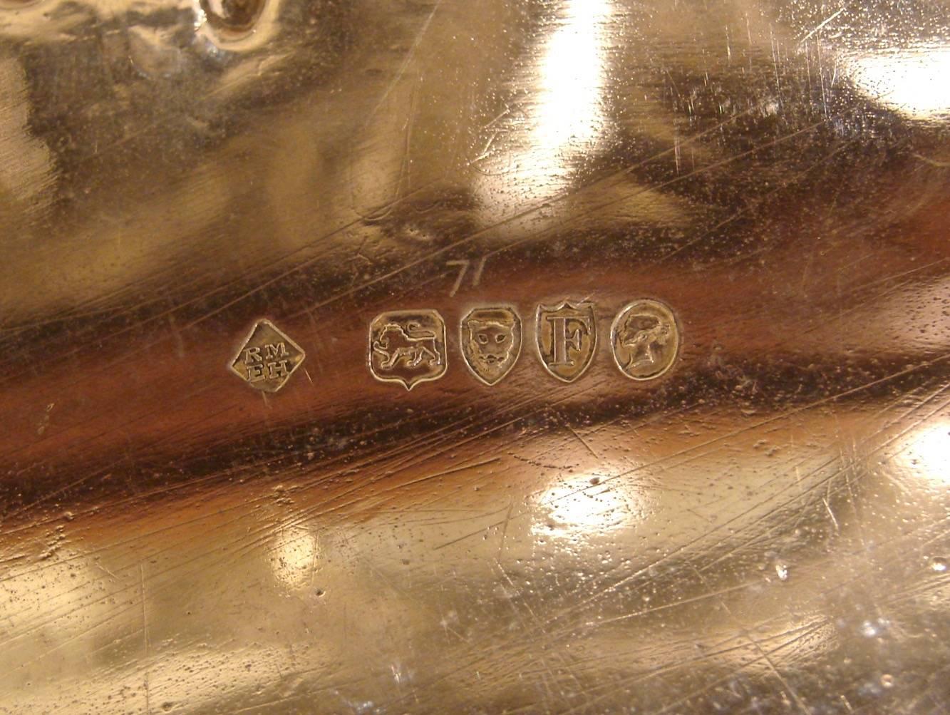 A fine sterling silver charger of large-scale in the Georgian style with a central cartouche monogrammed S a pie crust decorated edge resting on engraved ball and claw feet. Made by Martin Hall and Company, London 1881.
Weight is 31 troy ounces.