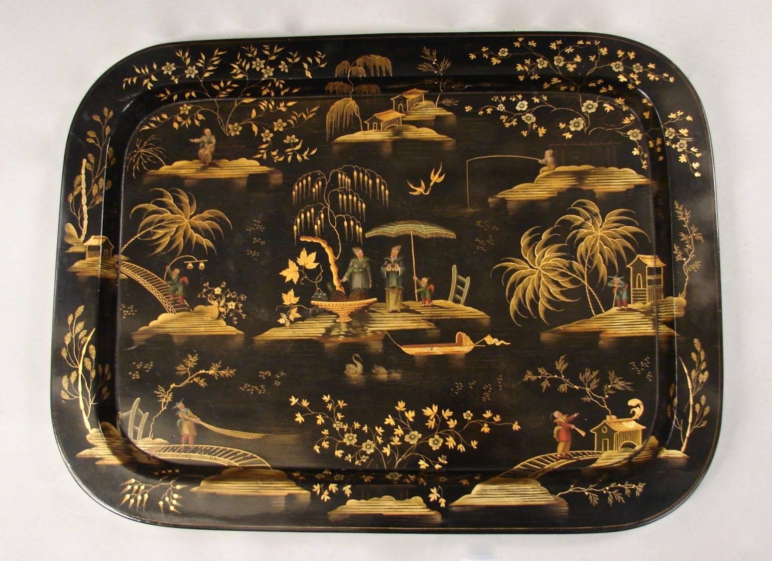A fine quality Regency papier mache tray in excellent overall condition, the beautifully executed tray depicting a mythological Chinese river scene with fisherman, swans and trees, circa 1825.