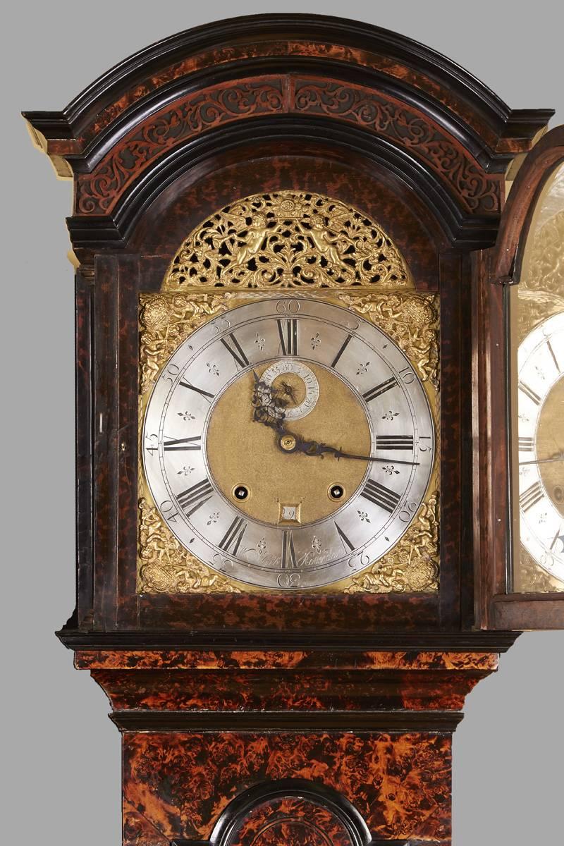 A lovely Anglo-Dutch tall case clock made and signed by William Gib of Rotterdam, the eight day time and strike movement with elaborate original spandrels, the silvered chapter ring enclosing a smaller second hand dial and calendar aperture, all in