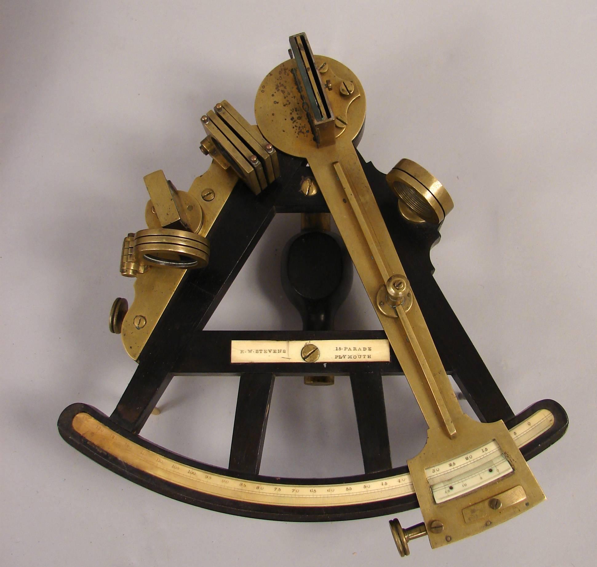 A good quality English ebony and brass octant, made and labeled by R. W. Stevens, retaining its original mahogany case, circa 1825.