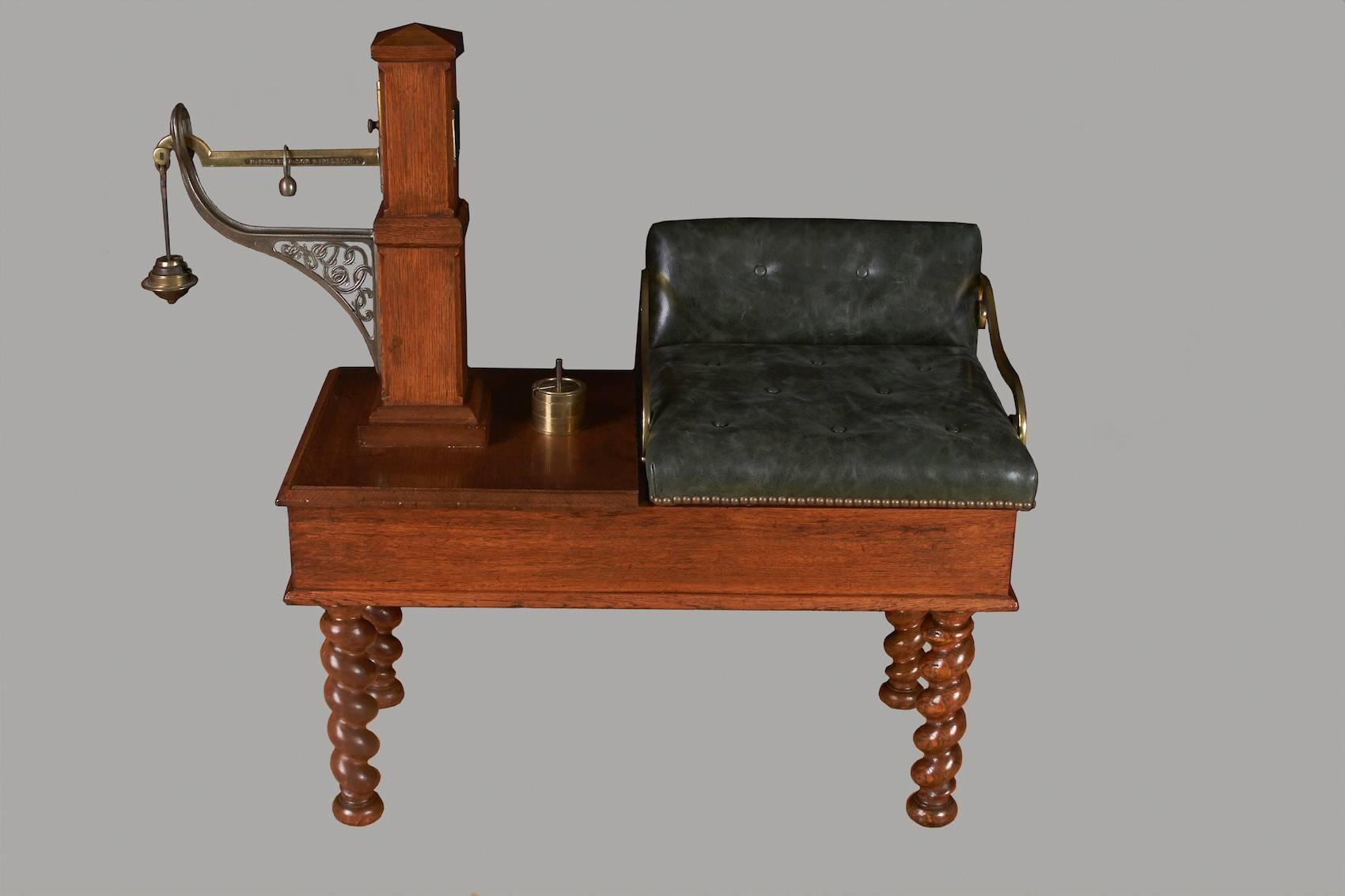 A rare oak and brass jockey scale made and signed by H.Pooley & Sons, London and Liverpool, the oak platform with a calibrated weight standard, brass signed maker's name plate and upholstered seat with brass arms, supported on rope turned legs