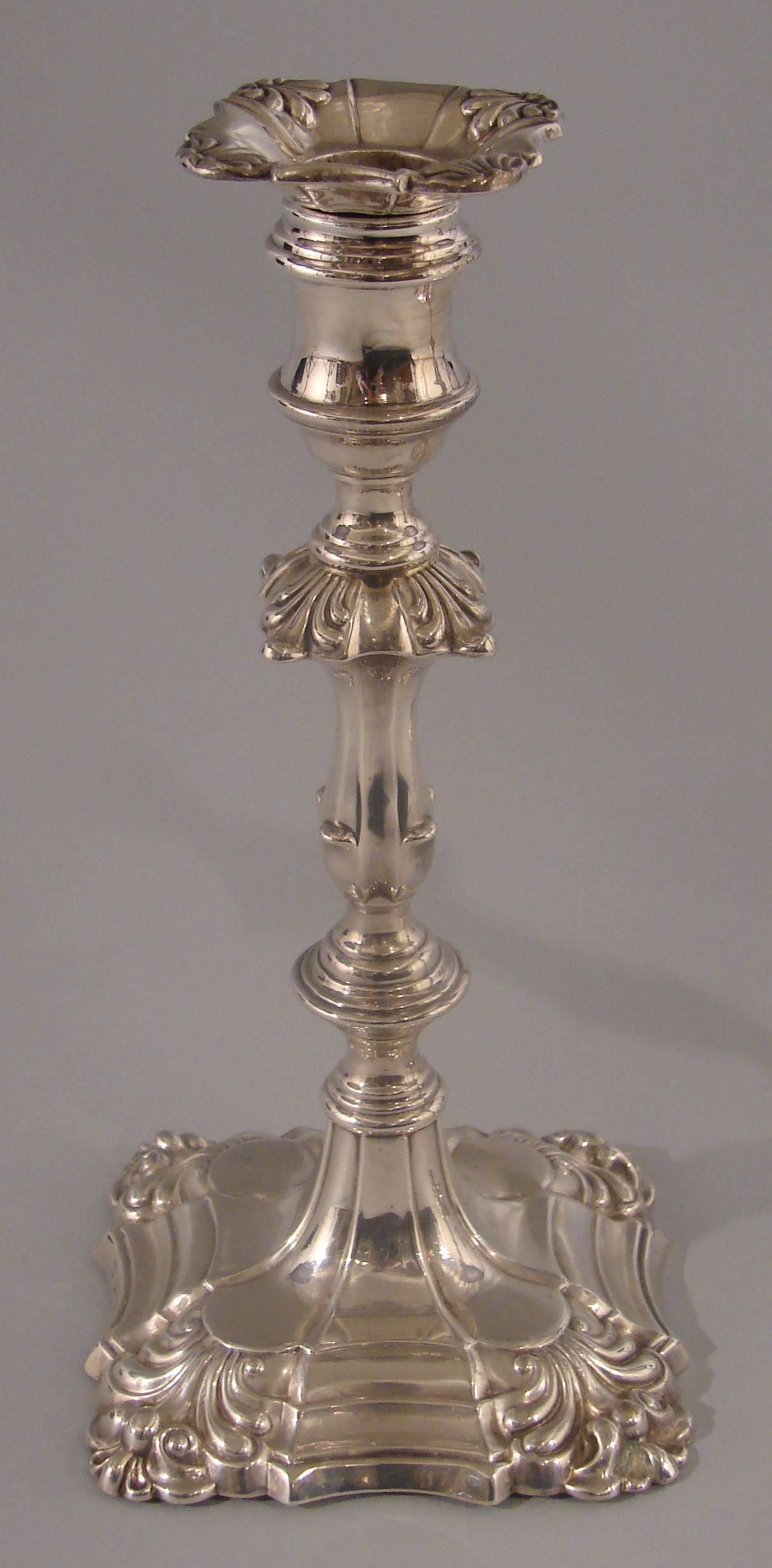 A pair of English Georgian style sterling candlesticks, the sticks and bobeche fully hallmarked for WK & Co. Sheffield, circa 1859. Weighted.