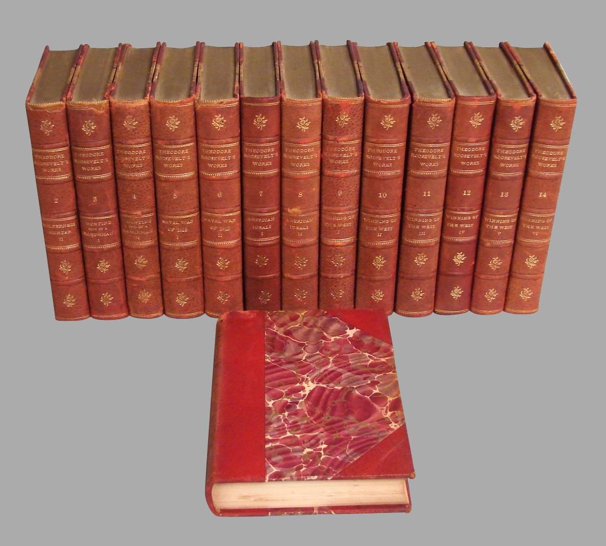 A complete set of the works of Theodore Roosevelt in 14 volumes bound in 3/4 red morocco with raised spines, published by G.P. Putnam's Sons, 1915.
  