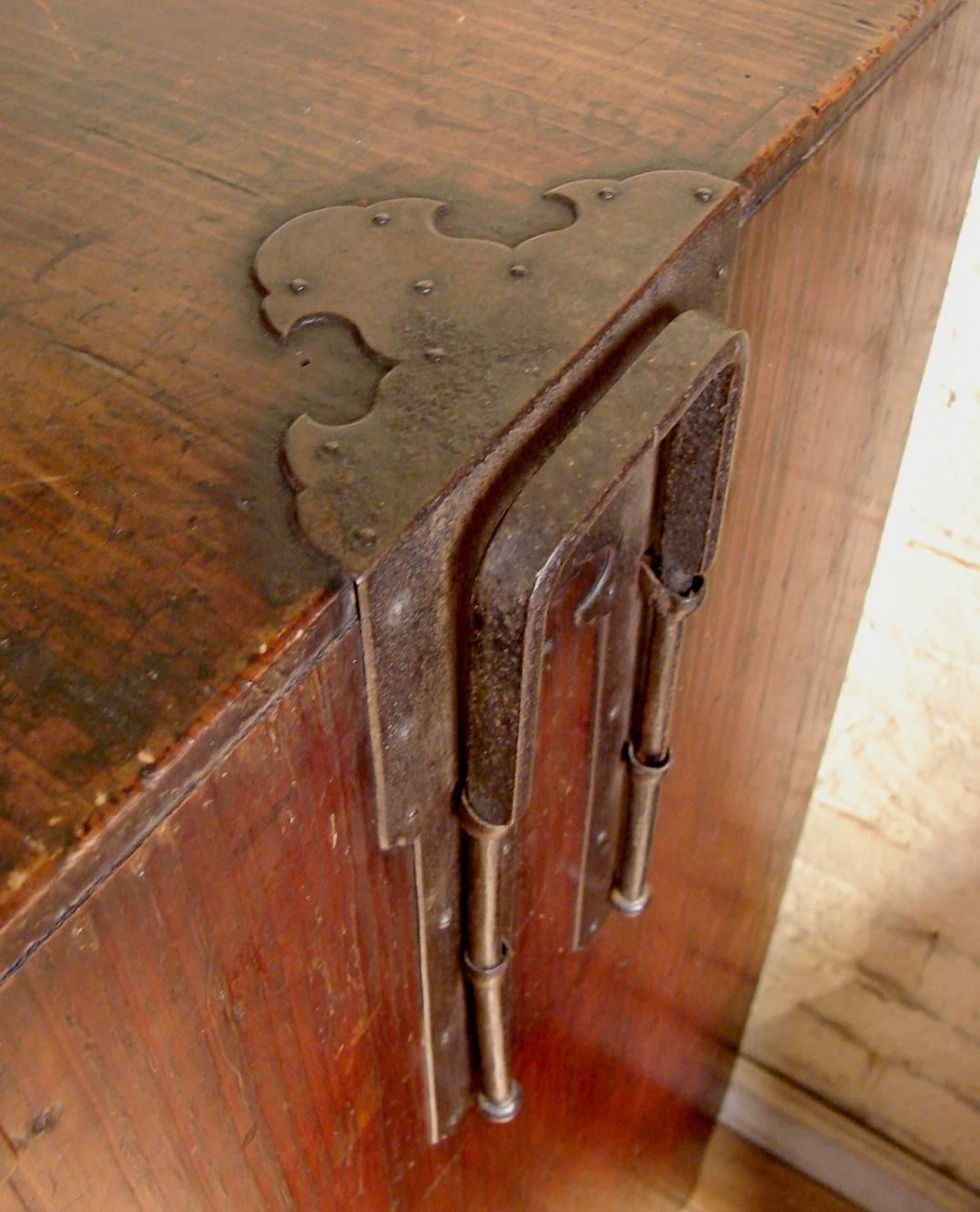 A fine Japanese late Edo period keyaki wood (elm) Choba tansu (merchant's chest) with multiple drawers of various sizes including a sliding section and a side lockbox with 3 interior drawers. The wonderful iron hardware on this tansu is in excellent