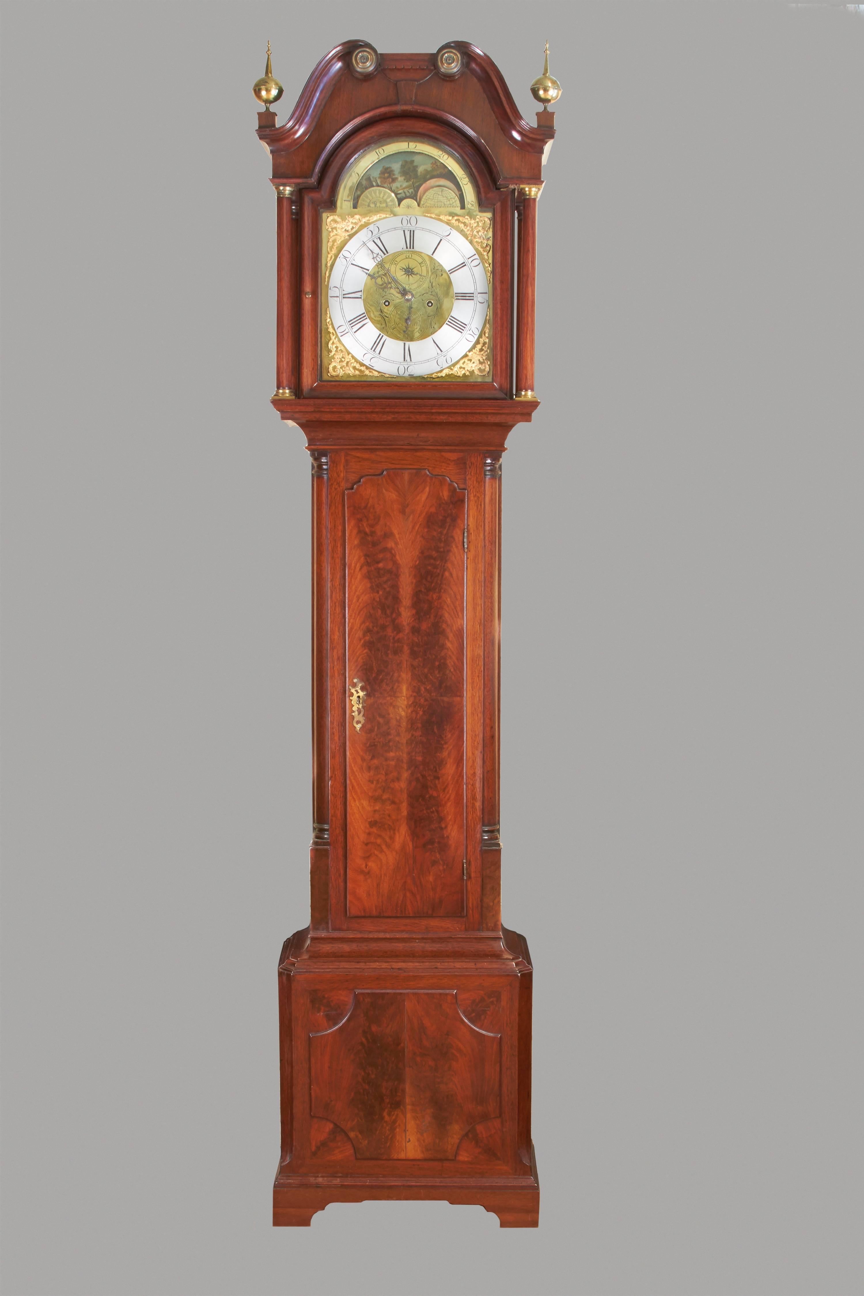 A good late Georgian period mahogany tall case clock with an 8 day time and strike movement, the brass face with a silvered chapter ring and Roman numeral dial, functional moon phase, calendar and second hand, signed Stott Wakefield,
circa
