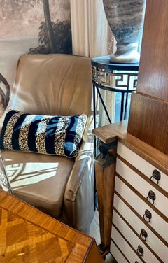 Pair of taupe leather, skirted slip-covered Verellen chairs on casters