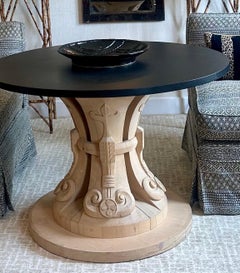 Custom hand-carved center table with black stone top, by Hendrix Allardyce