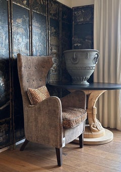 Modern wingback chair upholstered with luxurious velvet fabric