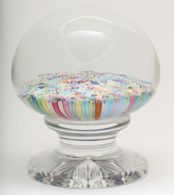 A 1991 Baccarat pedestal paperweight with a close-packed millefiori design, black and white Silhouette canes and B1991 cane, Baccarat stamp on base and 1991, 63/100.