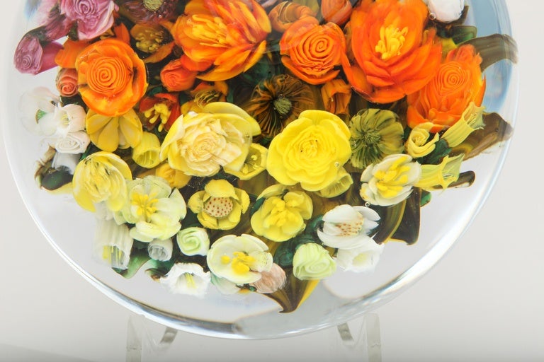 A beautiful magnum bouquet paperweight with rows of pink, orange and yellow mums, lilies, tea roses and assorted other flowers, signed R & M Ayotte, 2015.