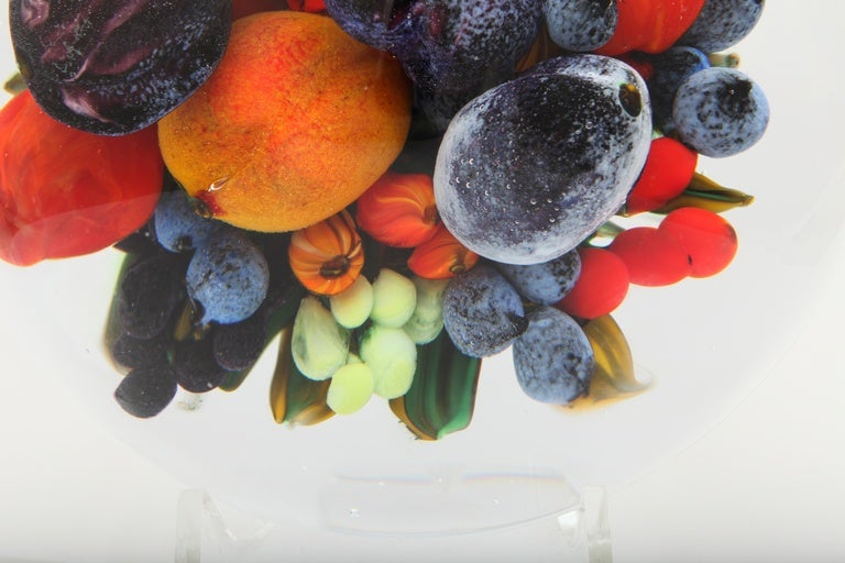 A beautiful and dimensional super fruit bouquet paperweight with plums, peaches, blueberries and assorted other fruit, signed Rick & Melissa Ayotte, 2015.