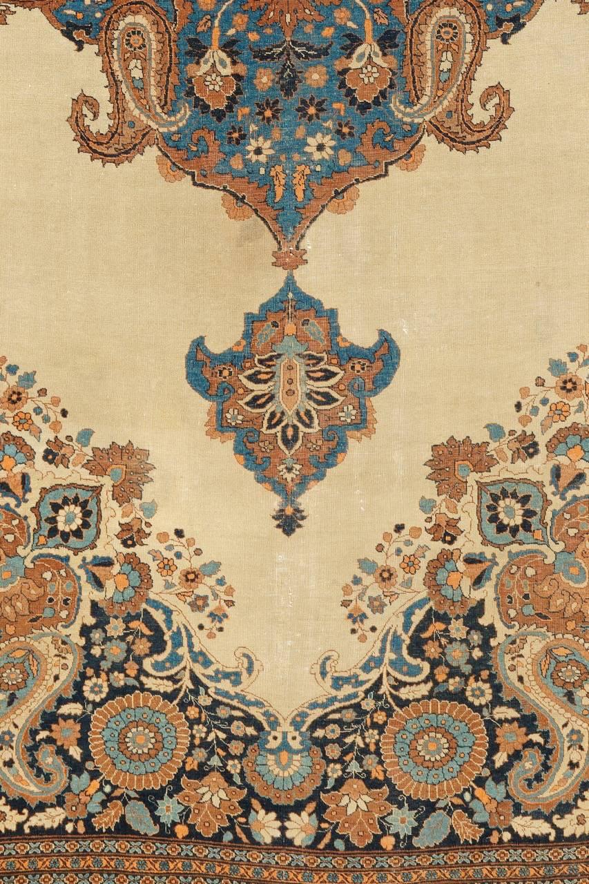 Tabriz carpets set a standard for elegance and are regarded as some of the finest Persian carpets of the nineteenth century. Using an unadulterated soft palette and balancing areas of open space with extraordinarily detailed drawing, this piece is a