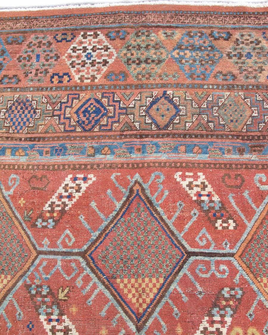 Hand-Woven Early 19th Century Red and Blue Khotan Carpet