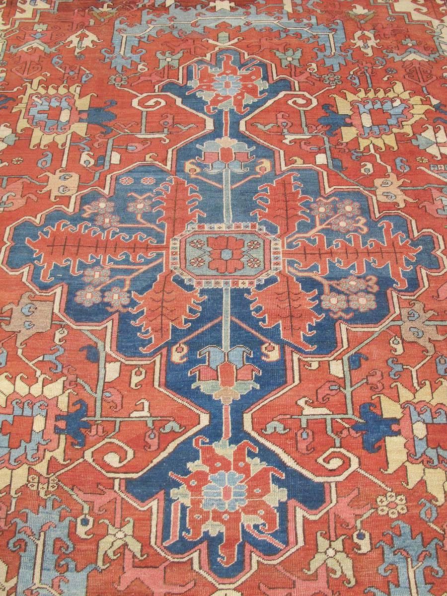 Hand-Woven Late 19th Century Red and Blue Indigo Serapi Carpet