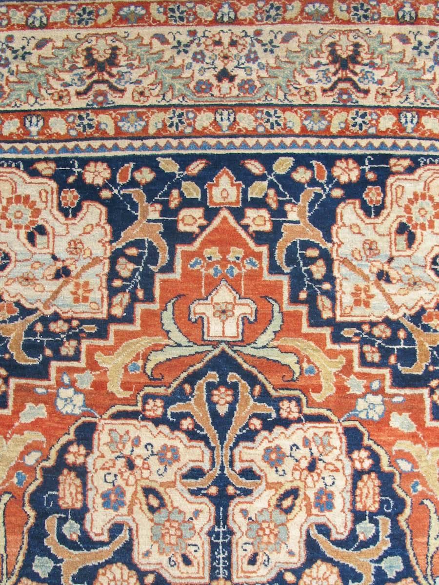 The central medallion format was arguably first developed in Tabriz during the late 15th century. This small Tabriz carpet portrays a decidedly neoclassical take on the Classic Persian type. Spanning the entire width of the field, a central