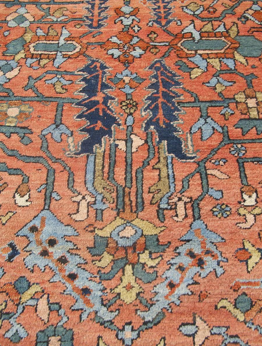 Persian Early 20th Century Red and Indigo Heriz Carpet with Palmettes and Blossoms