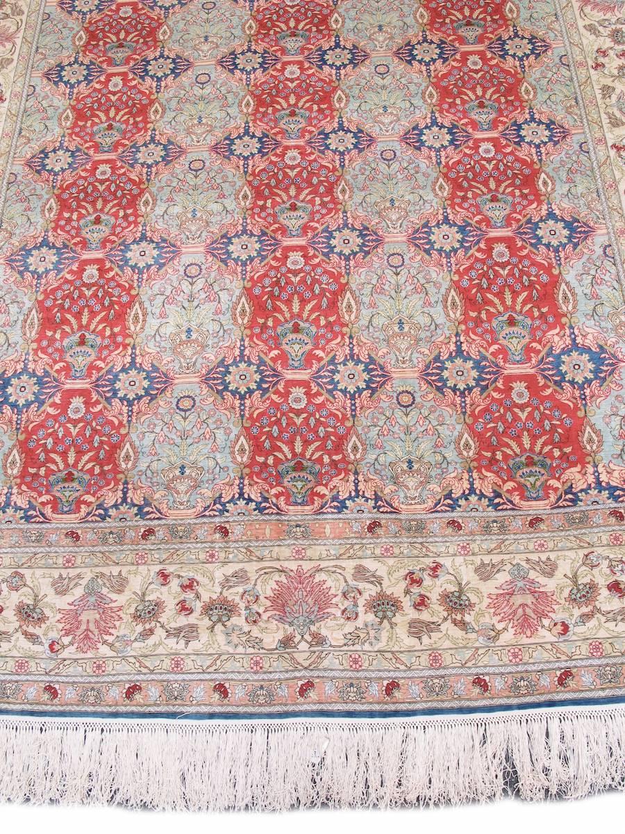 This extremely fine silk Turkish carpet from Kayseri has been inspired by the celebrated production of the Hereke manufactory which wove some of the finest Turkish carpets of the late 19th century at their workshop just outside of Istanbul. Using a