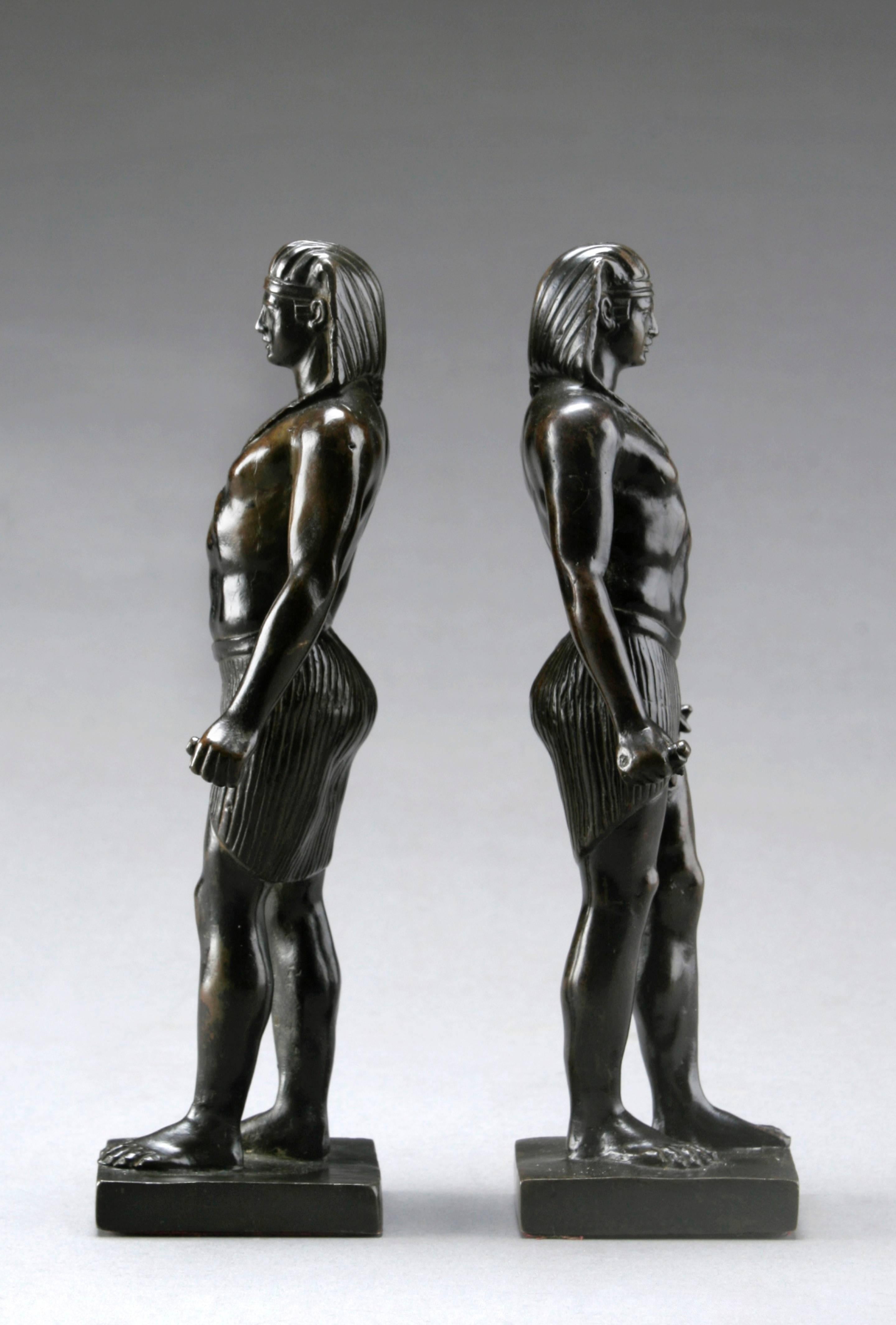 Pair of Patinated Bronze Small Statues of Antinous
Very good period sculptures with a beautiful patina; a brilliant rendition of this ancient sculpture type.  Each figure with Egyptian headdress and shenti, the outstretched hands grasping rods, the