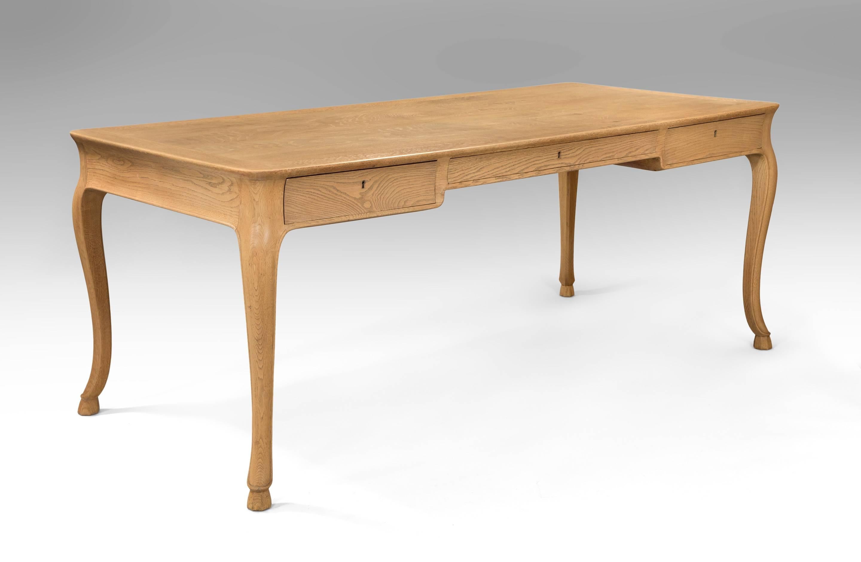 Frits Henningsen, Large Danish Elm and Oak Writing Table / Desk
A beautiful table in a very sophisticated and honest design by Henningsen one of the leading designers and craftsmen of his time. Would make a terrific center or library table. The