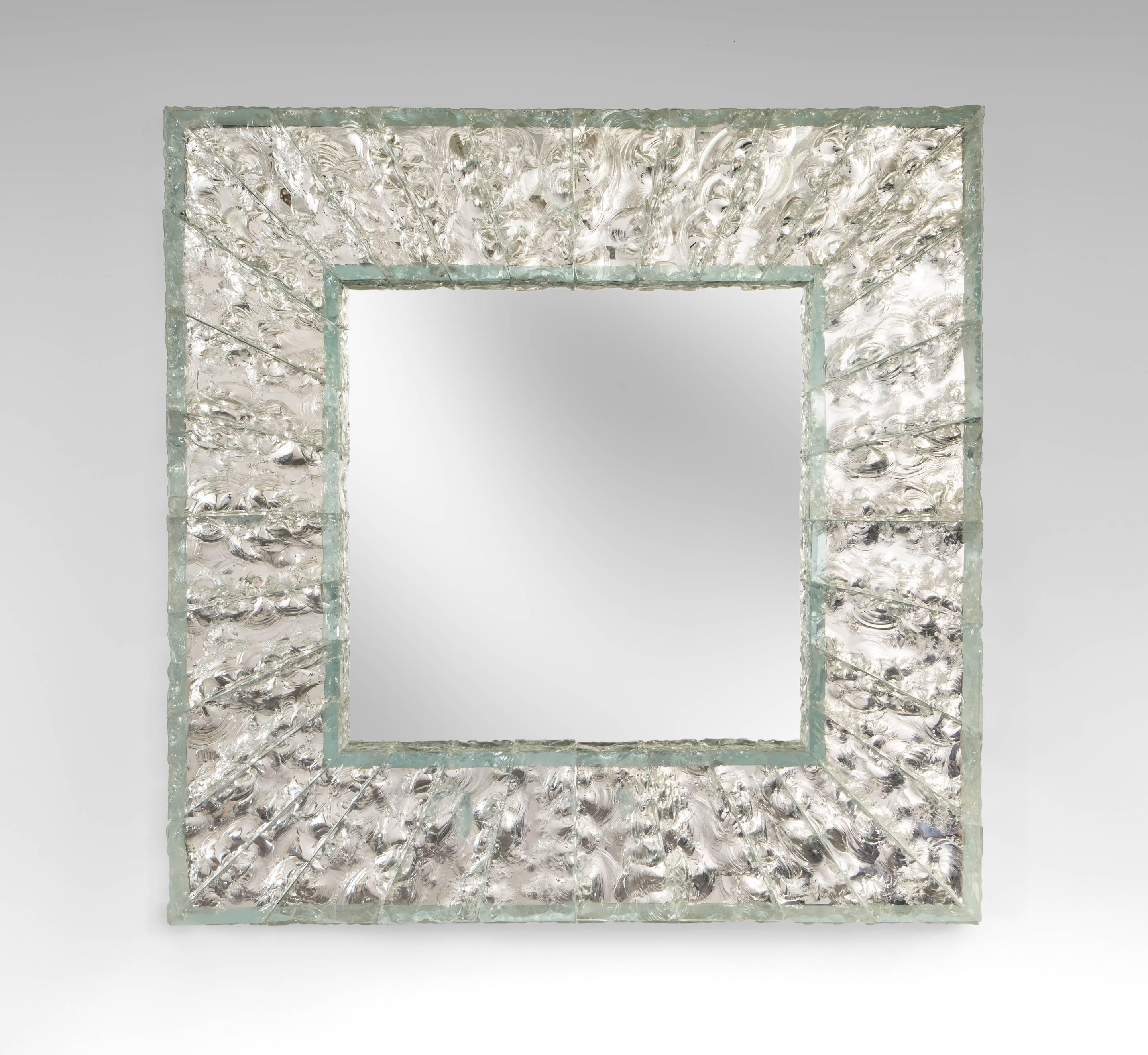 Roberto Rida, Pair of Large Martelé Colorless Glass Mirrors
Exceptional glass frames in a very desirable square format. Each square mirror plate within a frame composed of individual chiseled glass pieces.